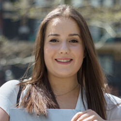 Female Business Student with book in hand. 